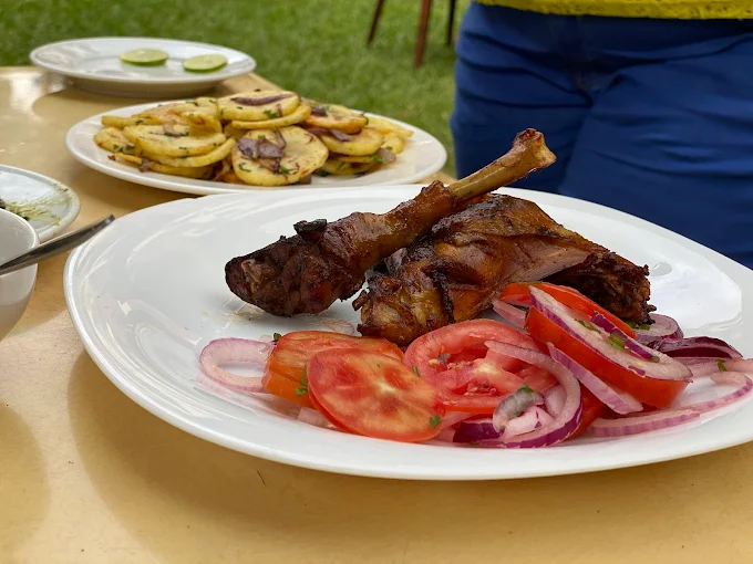 Fried goat with tomato kachumbari and chapati at K'Osewe Westlands