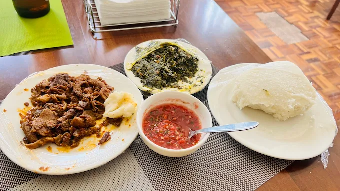 Matumbo with ugali and greens